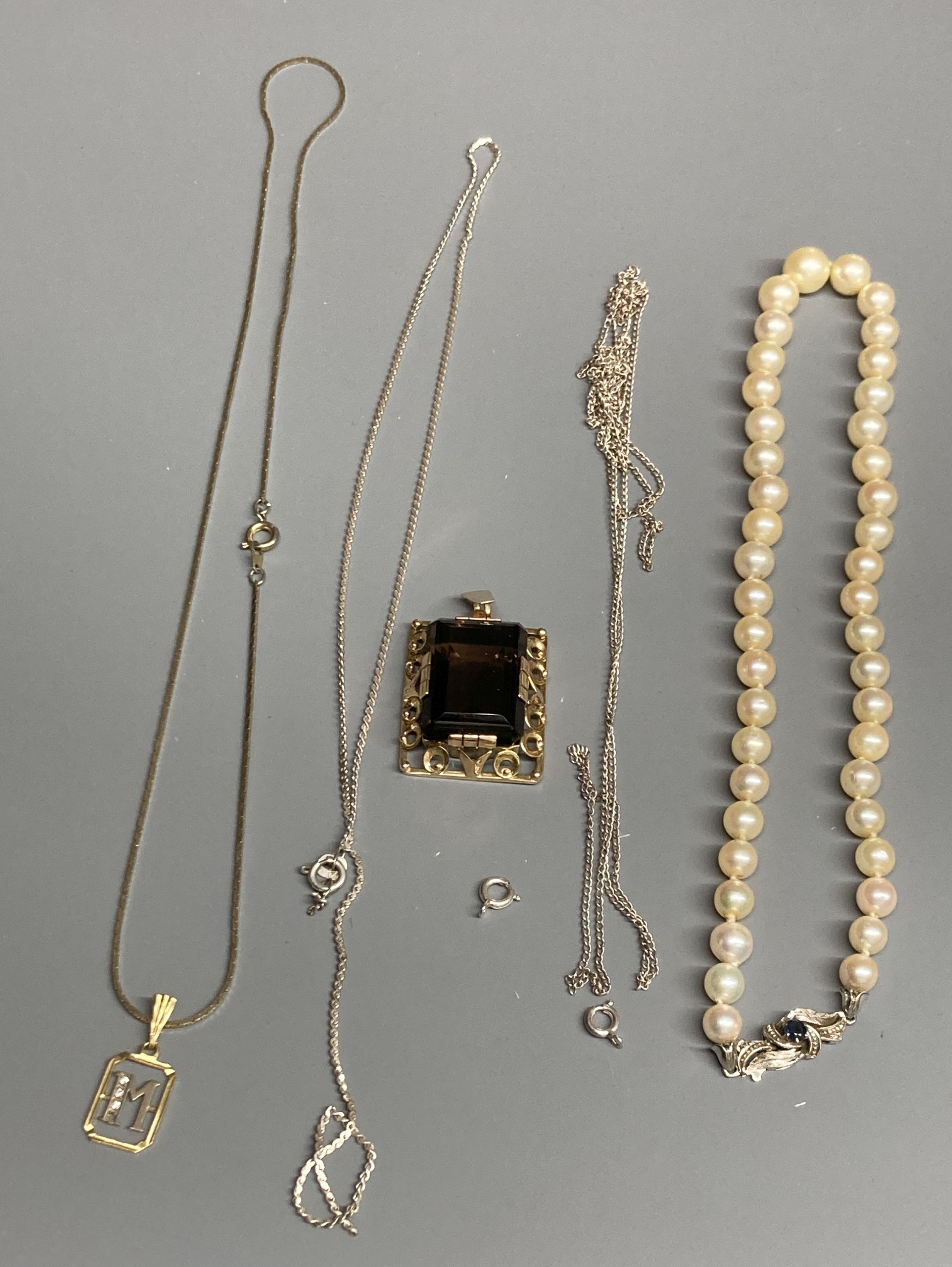 A single strand cultured pearl choker necklace, with 18ct white gold and sapphire set clasp, a 14ct and smoky quartz pendant, gross 17.8 grams, two 925 chains and a 750 small pendant(a.f.) on a gilt metal chain.